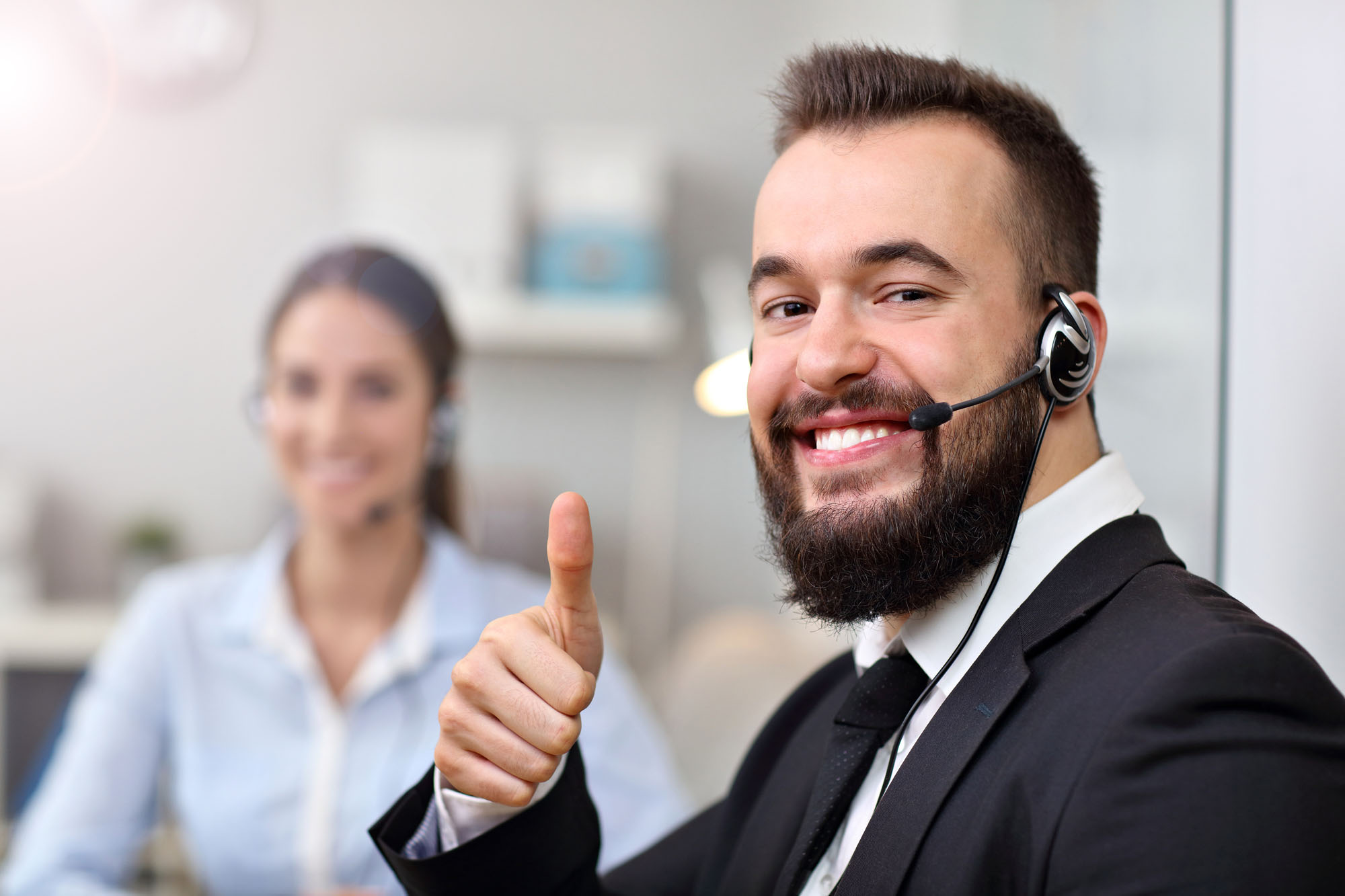 Picture showing happy man in call center